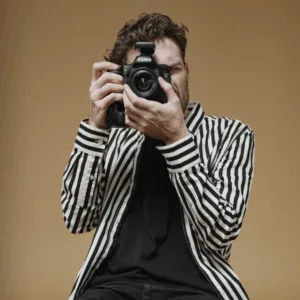 photographer pointing the camera in a photoshoot